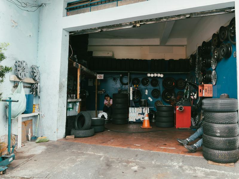 Sample photo: an open tire-shop bay with tires stacked by the door